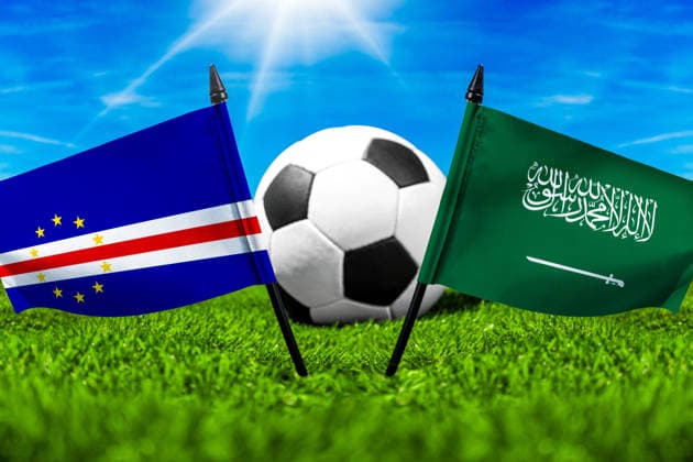 May 22, 2026: PHOTO MONTAGE, 2026 FIFA World Cup, WM, Weltmeisterschaft, Fussball National flags of Cape Verde and Saudi Arabia with a soccer ball on the field. Stock image for the group stage match on June 27 at the 2026 FIFA World Cup *** FOTOMONTAGE, Fußball-Weltmeisterschaft 2026: Nationalflaggen von Kap Verde und Saudi-Arabien mit Fußball auf Rasen. Symbolbild zum WM-Gruppenspiel am 27 Juni bei der FIFA Fussball-Weltmeisterschaft 2026
