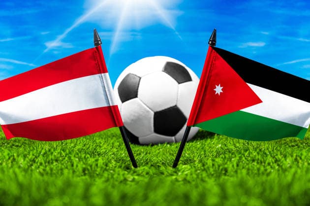 May 22, 2026: PHOTO MONTAGE, 2026 FIFA World Cup, WM, Weltmeisterschaft, Fussball National flags of Austria and Jordan with a soccer ball on the field. Illustrative image for the group stage match on June 17 at the 2026 FIFA World Cup *** FOTOMONTAGE, Fußball-Weltmeisterschaft 2026: Nationalflaggen von Österreich und Jordanien mit Fußball auf Rasen. Symbolbild zum WM-Gruppenspiel am 17 Juni bei der FIFA Fussball-Weltmeisterschaft 2026