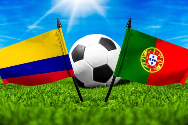 May 22, 2026: PHOTO MONTAGE, 2026 FIFA World Cup, WM, Weltmeisterschaft, Fussball National flags of Colombia and Portugal with a soccer ball on a field. Stock image for the group stage match on June 28 at the 2026 FIFA World Cup *** FOTOMONTAGE, Fußball-Weltmeisterschaft 2026: Nationalflaggen von Kolumbien und Portugal mit Fußball auf Rasen. Symbolbild zum WM-Gruppenspiel am 28 Juni bei der FIFA Fussball-Weltmeisterschaft 2026