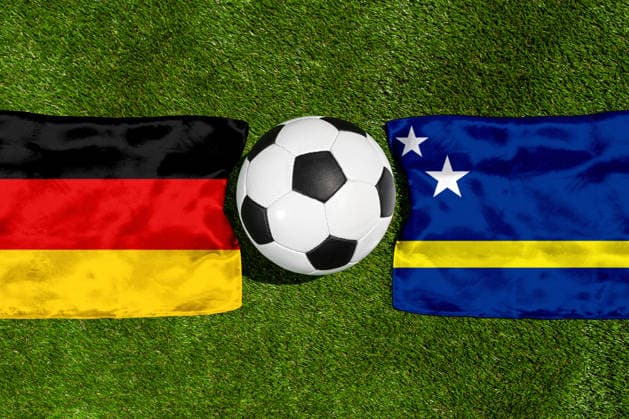 May 22, 2026: PHOTO MONTAGE, 2026 FIFA World Cup, WM, Weltmeisterschaft, Fussball National flags of Germany and Curacao with a soccer ball on the field. Illustrative image for the group stage match on June 14 at the 2026 FIFA World Cup *** FOTOMONTAGE, Fußball-Weltmeisterschaft 2026: Nationalflaggen von Deutschland und Curacao mit Fußball auf Rasen. Symbolbild zum WM-Gruppenspiel am 14 Juni bei der FIFA Fussball-Weltmeisterschaft 2026