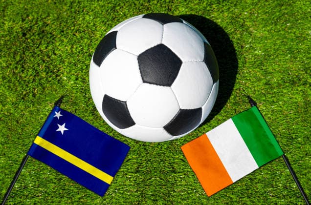 May 22, 2026: PHOTO MONTAGE, 2026 FIFA World Cup, WM, Weltmeisterschaft, Fussball National flags of Curacao and Ivory Coast with a soccer ball on a field. Stock image for the group stage match on June 25 at the 2026 FIFA World Cup *** FOTOMONTAGE, Fußball-Weltmeisterschaft 2026: Nationalflaggen von Curacao und Elfenbeinküste mit Fußball auf Rasen. Symbolbild zum WM-Gruppenspiel am 25 Juni bei der FIFA Fussball-Weltmeisterschaft 2026