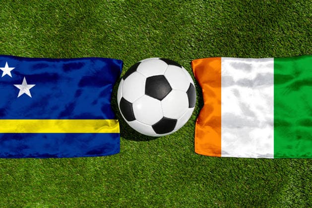 May 22, 2026: PHOTO MONTAGE, 2026 FIFA World Cup, WM, Weltmeisterschaft, Fussball National flags of Curacao and Ivory Coast with a soccer ball on a field. Stock image for the group stage match on June 25 at the 2026 FIFA World Cup *** FOTOMONTAGE, Fußball-Weltmeisterschaft 2026: Nationalflaggen von Curacao und Elfenbeinküste mit Fußball auf Rasen. Symbolbild zum WM-Gruppenspiel am 25 Juni bei der FIFA Fussball-Weltmeisterschaft 2026