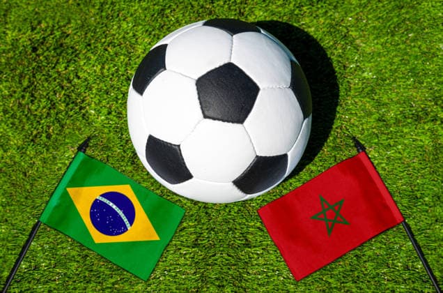 May 22, 2026: PHOTO MONTAGE, 2026 FIFA World Cup, WM, Weltmeisterschaft, Fussball National flags of Brazil and Morocco with a soccer ball on the field. Illustrative image for the group stage match on June 14 at the 2026 FIFA World Cup *** FOTOMONTAGE, Fußball-Weltmeisterschaft 2026: Nationalflaggen von Brasilien und Marokko mit Fußball auf Rasen. Symbolbild zum WM-Gruppenspiel am 14 Juni bei der FIFA Fussball-Weltmeisterschaft 2026