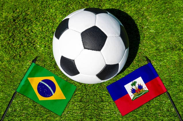 May 22, 2026: PHOTO MONTAGE, 2026 FIFA World Cup, WM, Weltmeisterschaft, Fussball National flags of Brazil and Haiti with a soccer ball on the field. Stock image for the group stage match on June 20 at the 2026 FIFA World Cup *** FOTOMONTAGE, Fußball-Weltmeisterschaft 2026: Nationalflaggen von Brasilien und Haiti mit Fußball auf Rasen. Symbolbild zum WM-Gruppenspiel am 20 Juni bei der FIFA Fussball-Weltmeisterschaft 2026