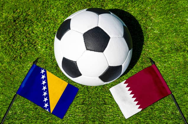 May 22, 2026: PHOTO MONTAGE, 2026 FIFA World Cup, WM, Weltmeisterschaft, Fussball National flags of Bosnia and Herzegovina and Qatar with a soccer ball on the field. Stock image for the group stage match on June 22 at the 2026 FIFA World Cup *** FOTOMONTAGE, Fußball-Weltmeisterschaft 2026: Nationalflaggen von Bosnien Herzegowina und Katar mit Fußball auf Rasen. Symbolbild zum WM-Gruppenspiel am 22 Juni bei der FIFA Fussball-Weltmeisterschaft 2026