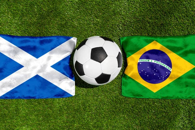 May 22, 2026: PHOTO MONTAGE, 2026 FIFA World Cup, WM, Weltmeisterschaft, Fussball National flags of Scotland and Brazil with a soccer ball on a field. Stock image for the group stage match on June 25 at the 2026 FIFA World Cup *** FOTOMONTAGE, Fußball-Weltmeisterschaft 2026: Nationalflaggen von Schottland und Brasilien mit Fußball auf Rasen. Symbolbild zum WM-Gruppenspiel am 25 Juni bei der FIFA Fussball-Weltmeisterschaft 2026