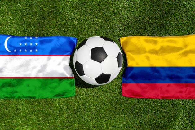 May 22, 2026: PHOTO MONTAGE, 2026 FIFA World Cup, WM, Weltmeisterschaft, Fussball National flags of Uzbekistan and Colombia with a soccer ball on a field. Illustrative image for the group stage match on June 18 at the 2026 FIFA World Cup *** FOTOMONTAGE, Fußball-Weltmeisterschaft 2026: Nationalflaggen von Usbekistan und Kolumbien mit Fußball auf Rasen. Symbolbild zum WM-Gruppenspiel am 18 Juni bei der FIFA Fussball-Weltmeisterschaft 2026