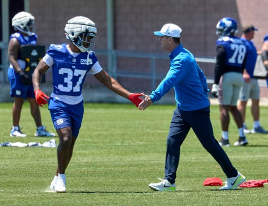 New York Giants head coach John Harbaugh and running back Damon Bankston (37) during organized team activities at the Quest Diagnostics Training Center in East Rutherford, New Jersey on Friday, May 29, 2026. CSM East Rutherford United States - ZUMAc04_ 20260529_zma_c04_003 Copyright: xDuncanxWilliamsx