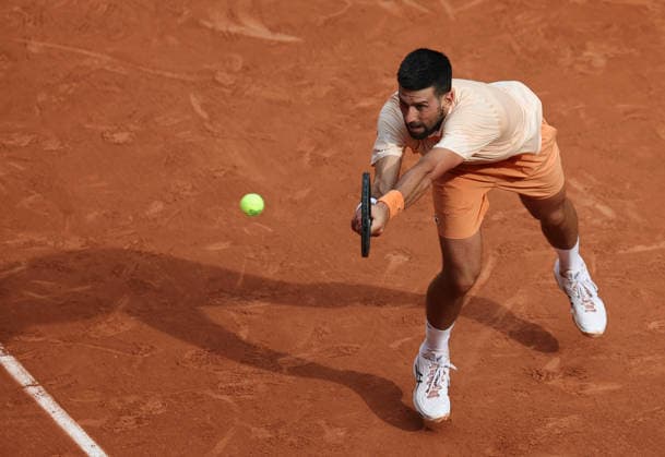 (260530) -- PARIS, May 30, 2026 -- Novak Djokovic hits a return during the men s singles third round match between Novak Djokovic of Serbia and Joao Fonseca of Brazil at the French Open tennis tournament at Roland Garros, Paris, France, May 29, 2026. ) (SP)FRANCE-PARIS-TENNIS-FRENCH OPEN-MEN S SINGLES WuxHuiwo 