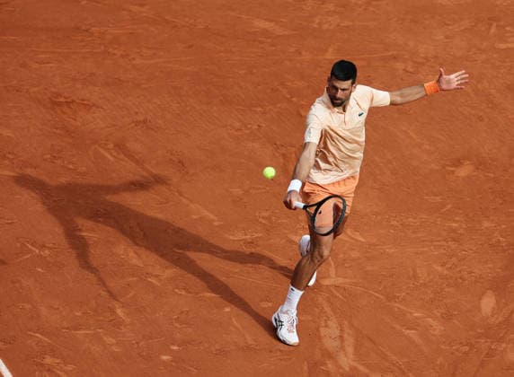 (260530) -- PARIS, May 30, 2026 -- Novak Djokovic hits a return during the men s singles third round match between Novak Djokovic of Serbia and Joao Fonseca of Brazil at the French Open tennis tournament at Roland Garros, Paris, France, May 29, 2026. ) (SP)FRANCE-PARIS-TENNIS-FRENCH OPEN-MEN S SINGLES WuxHuiwo 