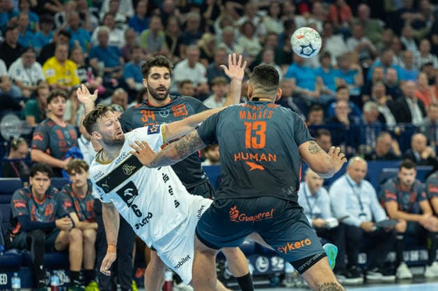 Harald Reinkind THW Kiel and David Balaguer Montpellier Handball battle for the ball during the handball semi final of the Winamax EHF Finals 2026 between Montpellier Handball and THW Kiel at Barclays Arena on May 30, 2026 in Hamburg, Germany