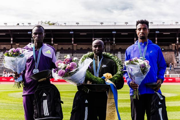 260530 Edwin Kiptoo, Kenya, Luke Kiprop, Kenya, Gezu Anbese Desu, Ethiopia, during the award ceremony after the Stockholm Marathon on May 30, 2026 in Stockholm  Copyright: KENTAxJÖNSSON BB260530KJ034