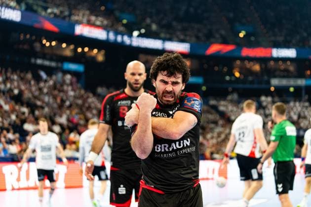 Erik Balenciaga 6 MT Melsungen clenches his fist and cheers intensely after an action in the match against SG Flensburg Handewitt Another MT Melsungen player with the back number 8 can be seen in the background MT Melsungen vs SG Flensburg Handewitt - EHF Finals Hamburg 2026 Copyright: xPhilippHeistx