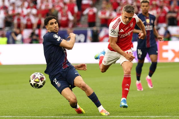 Achraf Hakimi of PSG and Leonardo Trossard of Arsenal compete for the ball during the 2025 2026 Champions League Final football match between Paris Saint Germain and Arsenal FC at Puskas Arena stadium in Budapest (Hungary), May 30th, 2026. CesarexPurini