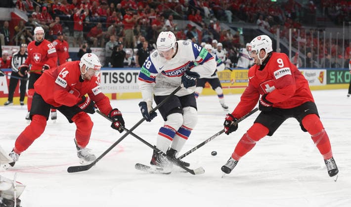 30 05 2026 Swiss Life Arena Zurich , SWITZERLAND, Mens Ice Hockey IIHF World Championship Zurich 2026 Semifinal SUI NOR Dean Kukan left,SUI against Michael Brandsegg Nygard center,NOR and Damien Riat SUI