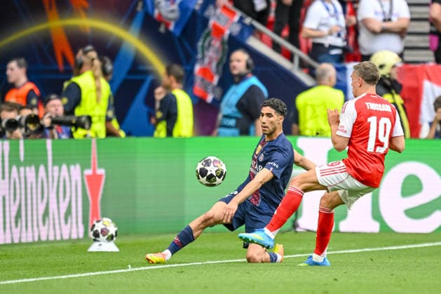Achraf Hakimi Paris Saint Germain FC and Leandro Trossard Arsenal FC battle for the ball during the UEFA Champions League Final 2026 match between Paris Saint Germain and Arsenal FC at Puskas Arena on May 30, 2026 in Budapest, Hungary Photo by Harry Langer DeFodi Images