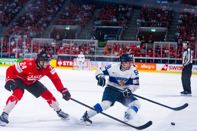 ZURICH, SWITZERLAND - MAY 30: Urho Vaakanainen (Finland, 58) in the battle for the puck with Dylan Cozens (Canada, 24) during the Half Finals - Match 62 between Canada and Finland at the IIHF Ice hockey, Eishockey World Championship, WM, Weltmeisterschaft 2026, Swiss Life Arena on May 30, 2026 in Zurich, Switzerland. Zurich Switzerland Copyright: xTimoxSteinx
