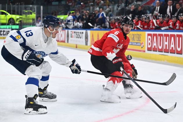 From left Jesse Puljujarvi of Finland and Sam Dickinson of Canada in action during the semifinal match Canada vs Finland at the 2026 IIHF Ice hockey, Eishockey World Championship, WM, Weltmeisterschaft on May 30, 2026, Zurich, Switzerland. (CTKxPhoto RadekxPetrasek) CTKPhotoP2026053005762  CTKPhotoP2026053005762