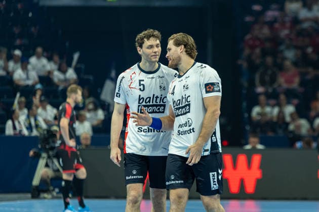 Niclas Kirkelokke SG Flensburg Handewitt and Johannes Golla SG Flensburg Handewitt speaks with during the handball semi final of the Winamax EHF Finals 2026 between MT Melsungen and SG Flensburg Handewitt at Barclays Arena on May 30, 2026 in Hamburg, Germany