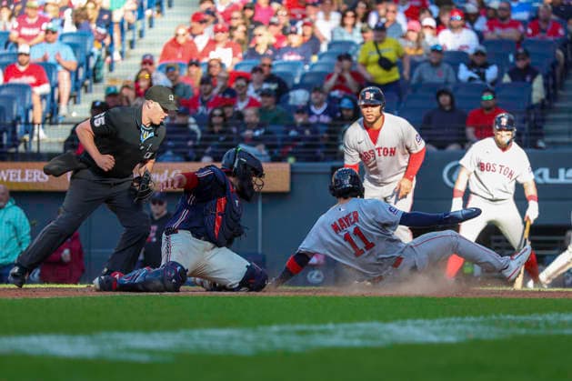 May 30, 2026: Cleveland Guardians catcher Austin Hedges (27) attempts to tag out Boston Red Sox second baseman Marcelo Mayer (11) at home plate in the ninth inning of the Major League Baseball game between the Boston Red Sox and Cleveland Guardians at Progressive Field in Cleveland, Ohio. CSM Cleveland United States of America - ZUMAc04_ 20260530_zma_c04_041 Copyright: xBrianxFisherx