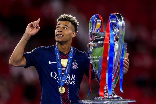 BUDAPEST, HUNGARY - MAY 30: Desire Doue of Paris Saint-Germain gestures while holding the UEFA Champions League trophy after the UEFA Champions League 2026 Final between Paris Saint-Germain and Arsenal FC at Puskas Arena on May 30, 2026 in Budapest, Hungary.  Copyright: xRenexNijhuis MBxMediax