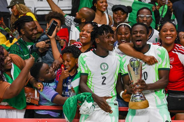 Jamaica v Nigeria, Unity Cup London 2026, Cup Final Nigeria defender Chibueze Oputa (2) and Nigeria forward Philip Otele (20) lifts the Unity Cup Trophy in front of the visiting fans after the Unity Cup London 2026 Final match between Jamaica and Nigeria at The Valley, London, UK on 30 May 2026. London The Valley Greater London UK Editorial use only , Copyright: xToyinxOshodix PSI-24348-0091