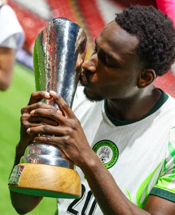 Jamaica v Nigeria, Unity Cup London 2026, Cup Final Nigeria forward Philip Otele (20) kisses the Unity Cup Trophy in front of the visiting fans after the Unity Cup London 2026 Final match between Jamaica and Nigeria at The Valley, London, UK on 30 May 2026. London The Valley Greater London UK Editorial use only , Copyright: xToyinxOshodix PSI-24348-0095