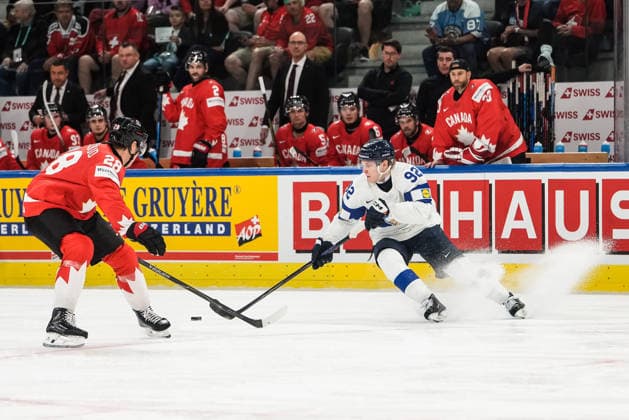 xxkeikkaxx 20260530 Swiss Life Arena, Zurich, Switzerland. IIHF Ice hockey, Eishockey World Championships Semifinal match Canada vs Finland Lenni Hämeenaho (92) of Team Finland makes a tight turn with the puck as Zach Whitecloud (28) of Team Canada defends. Photo by Pasi Suokko All Over Press  1.06241270