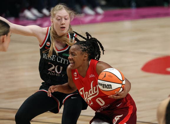 May 30, 2026: Indiana guard Kelsey Mitchell (0) drives past Portland Fire forward Frieda Buhner during the WNBA, Basketball Damen, USA game between the Portland Fire and the Indiana Fever at the Rose Garden, Portland, OR. CSM (Cal Media via AP Images) Portland USA - ZUMAc04_ 20260530_zma_c04_061 Copyright: xLarryxC.xLawsonx