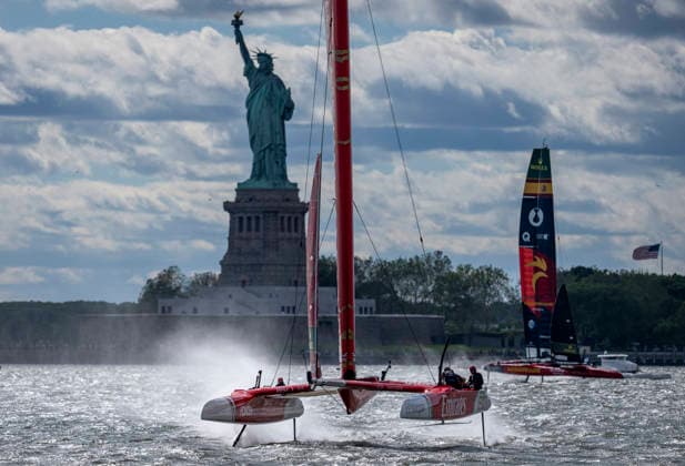 , Emirates Great Britain SailGP Team driven by Dylan Fletcher leads Los Gallos SailGP Team driven by Diego Botin past the Statue of Liberty during the first race on Race Day 1 of the Mubadala New York Sail Grand Prix in New York, USA. Saturday 30 May 2026. Rolex SailGP Championship Event 6 2026 Season. Photo: Jason Ludlow for SailGP. Handout image supplied by SailGP New York City United States  Copyright: xJasonxLudlowxforxSailGPx 0857940613st