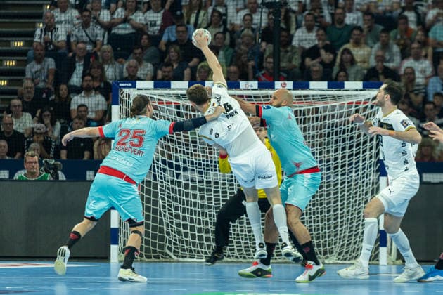 Goalkeeper Kristof Palasics MT Melsungen , Nikola Bilyk THW Kiel and Arnar Freyr Arnarsson MT Melsungen battle for the ball during the handball final of the Winamax EHF Finals 2026 between THW Kiel and MT Melsungen at Barclays Arena on May 31, 2026 in Hamburg, Germany