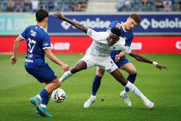 Genk s Aaron Bibout Banind and Gent s Mathias Delorge fight for the ball during a soccer match between KAA Gent and Racing Genk, Sunday 31 May 2026 in Gent, an European Play-off game of the 2025-2026 Jupiler Pro League first division of the Belgian championship. KURTxDESPLENTER  x175557319x