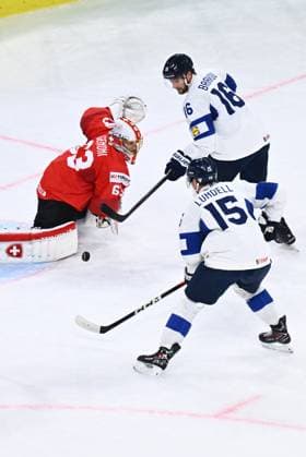 From left goalkeeper Leonardo Genoni of Switzerland, Aleksander Barkov and Anton Lundell of Finland in action during the final match Switzerland vs Finland at the 2026 IIHF Ice hockey, Eishockey World Championship, WM, Weltmeisterschaft in Zurich, Switzerland, May 31, 2026. (CTKxPhoto RadekxPetrasek) CTKPhotoP2026053105540  CTKPhotoP2026053105540