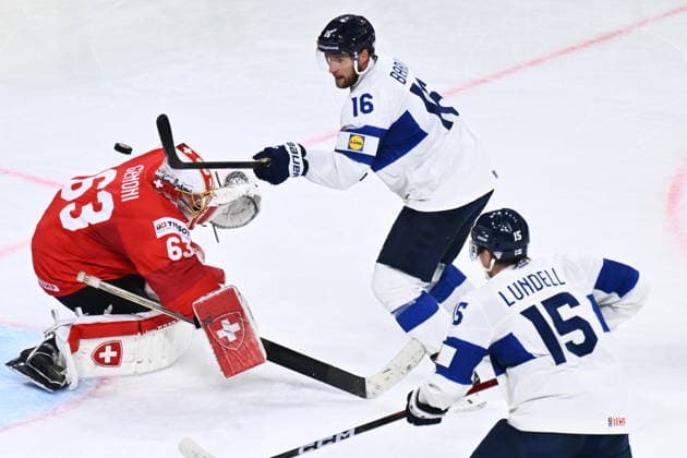 Goalkeeper Leonardo Genoni of Switzerland, Aleksander Barkov and Anton Lundell of Finland in action during the final match Switzerland vs Finland at the 2026 IIHF Ice hockey, Eishockey World Championship, WM, Weltmeisterschaft in Zurich, Switzerland, May 31, 2026. (CTKxPhoto RadekxPetrasek) CTKPhotoP2026053105566  CTKPhotoP2026053105566