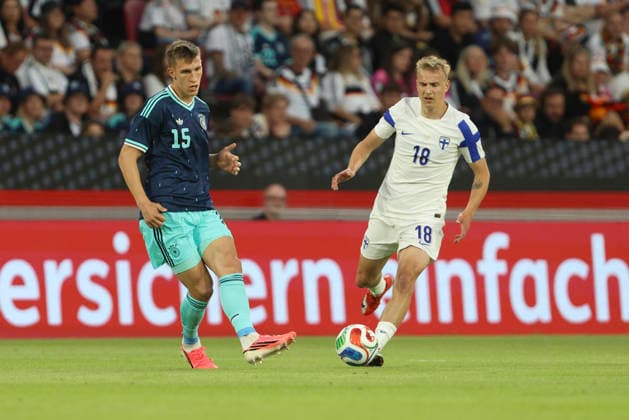 Nico Schlotterbeck Germany and Topi Keskinen Finland battle for the ball during the international friendly match between Germany and Finland at MEWA Arena on May 31, 2026 in Mainz, Germany Photo by Oliver Kaelke DeFodi Images