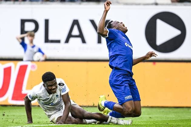 Genk s Josue Kongolo and Gent s Hyllarion Goore pictured in action during a soccer match between KAA Gent and Racing Genk, Sunday 31 May 2026 in Gent, an European Play-off game of the 2025-2026 Jupiler Pro League first division of the Belgian championship. TOM GOYVAERTS TomxGoyvaerts  x175564602x