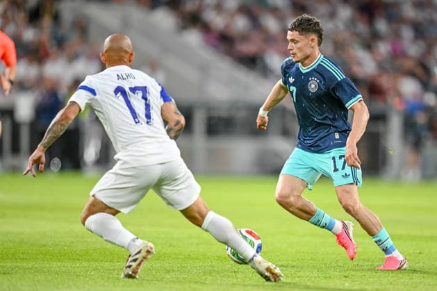 Nikolai Alho Finland and Florian Wirtz Germany battle for the ball during the international friendly match between Germany and Finland at MEWA Arena on May 31, 2026 in Mainz, Germany Photo by Harry Langer DeFodi Images