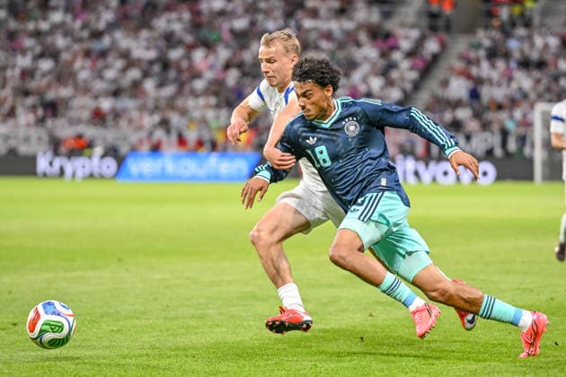 Topi Kesskinen Finland and Nathaniel Brown Germany battle for the ball during the international friendly match between Germany and Finland at MEWA Arena on May 31, 2026 in Mainz, Germany Photo by Harry Langer DeFodi Images