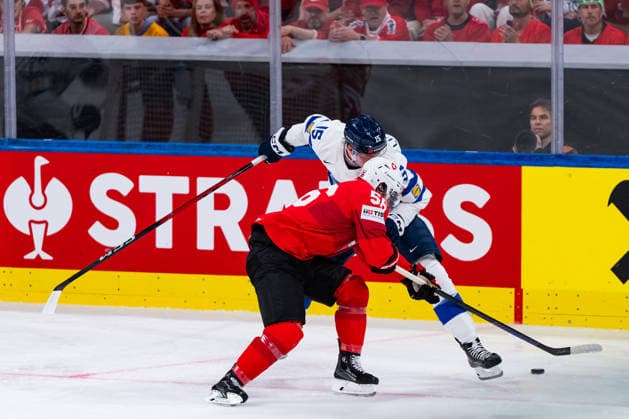 ZURICH, SWITZERLAND - MAY 31: Christian Marti (Switzerland, 54) in the battle for the puck with Anton Lundell (Finland, 15) during the Gold Medal Game - Match 64 between Switzerland and Finland at the IIHF Ice hockey, Eishockey World Championship, WM, Weltmeisterschaft 2026, Swiss Life Arena on May 31, 2026 in Zurich, Switzerland. Zurich Switzerland Copyright: xTimoxSteinx