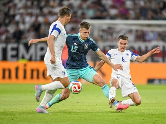 Robin Lod Finland, Nico Schlotterbeck Germany and Leo Walta Finland battle for the ball during the international friendly match between Germany and Finland at MEWA Arena on May 31, 2026 in Mainz, Germany Photo by Harry Langer DeFodi Images