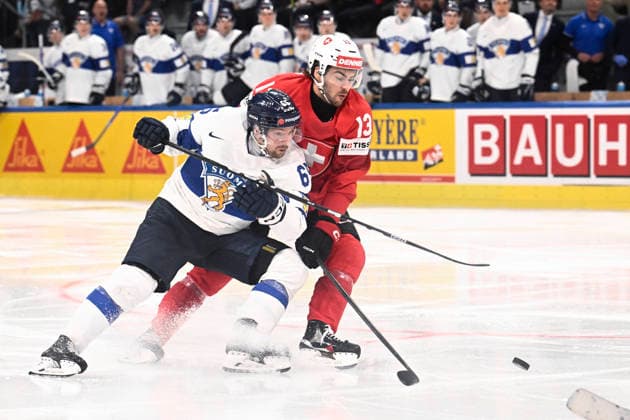 LKS 20260531 65 Sakari Manninen of Finland and 13 Nico Hischier of Switzerland fights for the puck during the 2026 IIHF Ice hockey, Eishockey World Championships final match between Switzerland and Finland in Zurich on May 31, 2026. - RONI REKOMAA Zürich Switzerland 69SRpeTc1jw  Copyright: xRonixRekomaax 69SRpeTc1jw