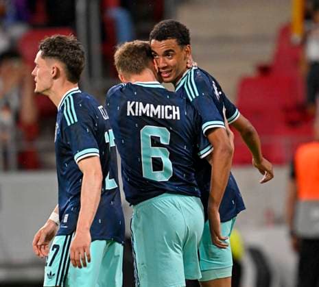 31 05 2026, Football friendly international match 3 match day, Germany Finland, in the Mewa Arena Mainz, f l Florian Wirtz Germany , Joshua Kimmich Germany and Jamal Musiala Germany cheer