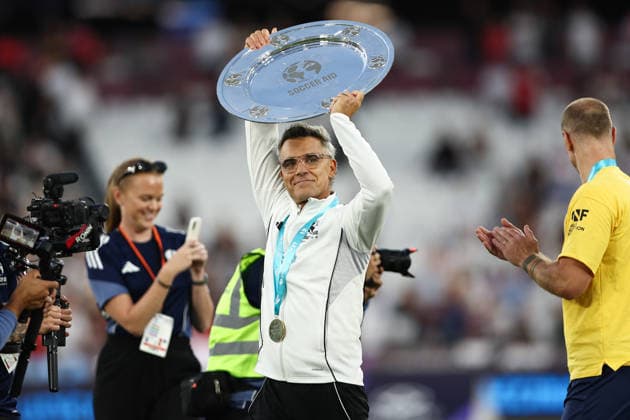 London, England, 31st May 2026. Robbie Williams of England lifts the trophy following victory during the England vs Soccer Aid World XI UNICEF Soccer Aid match at the London Stadium, London. Picture credit should read: Jake Youle Sportimage EDITORIAL USE ONLY. No use with unauthorised audio, video, data, fixture lists, club league logos or live services. Online in-match use limited to 120 images, no video emulation. No use in betting, games or single club league player publications. SPI_039_England_World_XI SPI-4829-0035