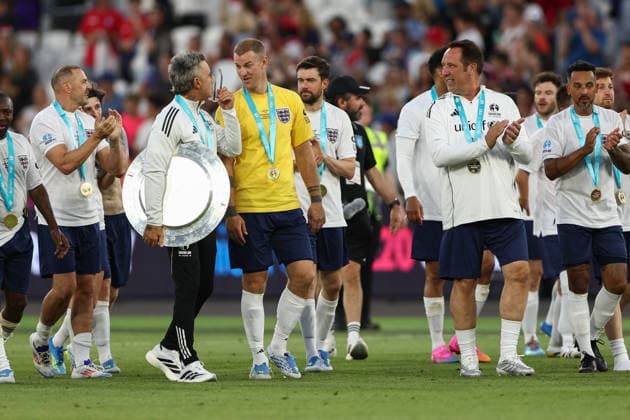 London, England, 31st May 2026. Robbie Williams of England jokes with Joe Hart of England following victory during the England vs Soccer Aid World XI UNICEF Soccer Aid match at the London Stadium, London. Picture credit should read: Jake Youle Sportimage EDITORIAL USE ONLY. No use with unauthorised audio, video, data, fixture lists, club league logos or live services. Online in-match use limited to 120 images, no video emulation. No use in betting, games or single club league player publications. SPI_045_England_World_XI SPI-4829-0044