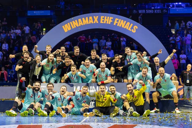 The Players of MT Melsungen celebrate at the award ceremony during the handball final of the Winamax EHF Finals 2026 between THW Kiel and MT Melsungen at Barclays Arena on May 31, 2026 in Hamburg, Germany