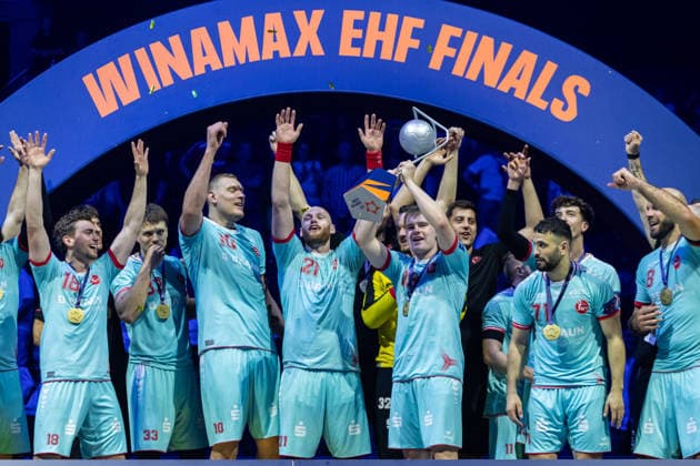 The Players of MT Melsungen celebrate at the award ceremony during the handball final of the Winamax EHF Finals 2026 between THW Kiel and MT Melsungen at Barclays Arena on May 31, 2026 in Hamburg, Germany