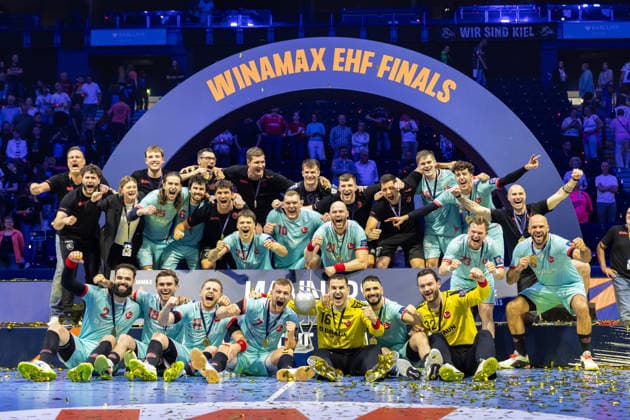 The Players of MT Melsungen celebrate at the award ceremony during the handball final of the Winamax EHF Finals 2026 between THW Kiel and MT Melsungen at Barclays Arena on May 31, 2026 in Hamburg, Germany