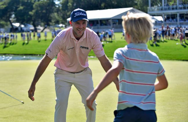 FORTH WORTH, TX - MAY 31: Russell Henley smiles as one of his kids runs up to him after winning the final round of the PGA, Golf Herren Charles Schwab Challenge at Colonial Country Club on Sunday, May 31, 2026 in Fort Worth, TX. (Photo by Austin McAfee Icon Sportswire) GOLF: MAY 31 PGA Charles Schwab Challenge EDITORIAL USE ONLY Icon260531005