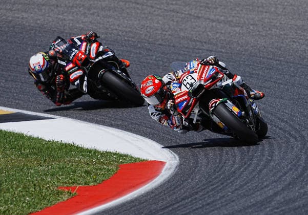 (260601) -- MUGELLO, June 1, 2026 -- Aprilia Racing s Marco Bezzecchi (L) of Italy chases Ducati Lenovo Team s Francesco Bagnaia (R) of Italy during the MotoGP Grand Prix of Italy at Autodromo Internazionale del Mugello near Scarperia, Tuscany, Italy, May 31, 2026. (SP)ITALY-MUGELLO-MOTOCYCLE-GRAND PRIX 2026-RACE (Xinhua) 