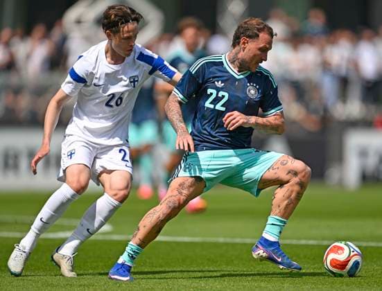 01 06 2026, Football, DFB national team Germany, last training session before departure to the USA for the 2026 World Cup, at the DFB Campus in Frankfurt am Main f l Casper Terho Finland vs David Raum Germany